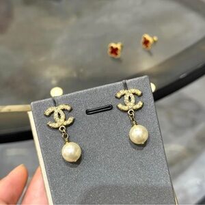 CHANEL Pearl Drop CC Logo Earrings in Gold and Cream